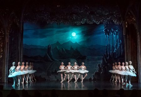 Ballet dancers in white tutus on stage