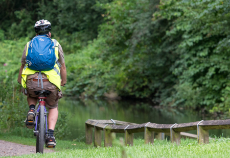 Man cycling away on a bike