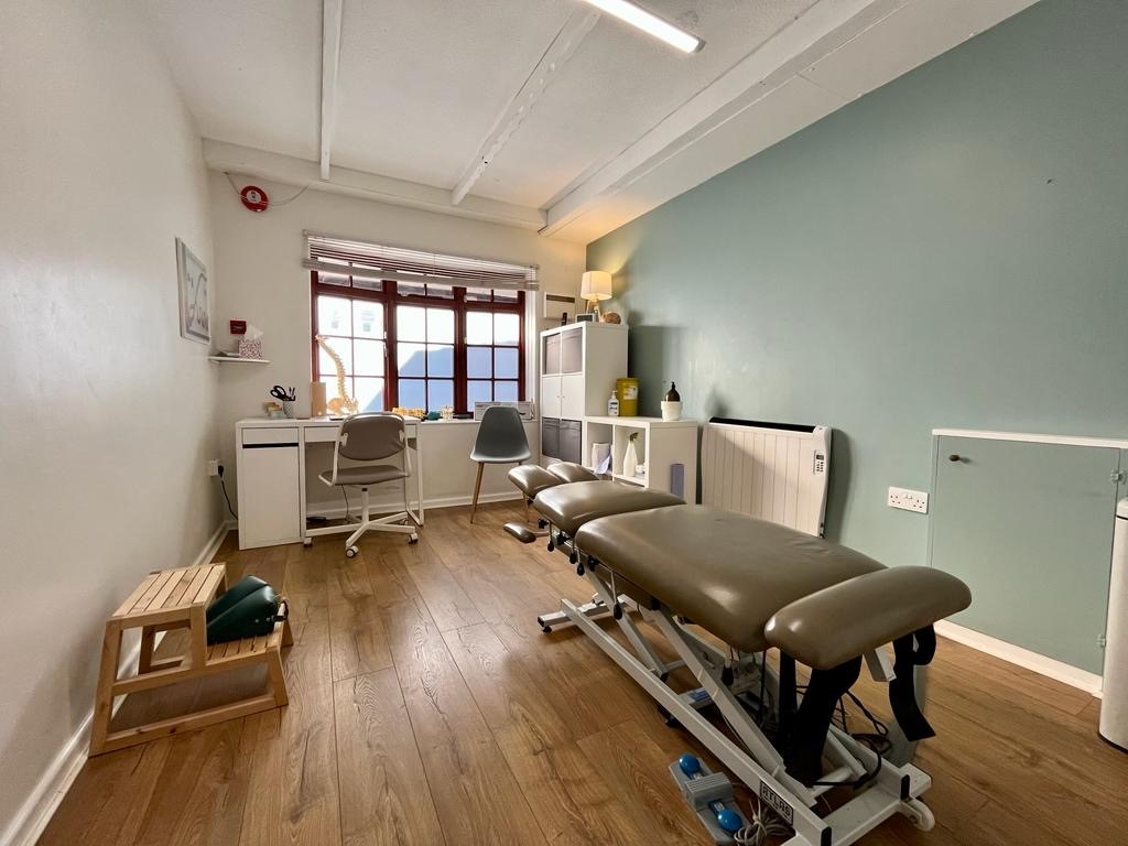 clinc room with a patient bed