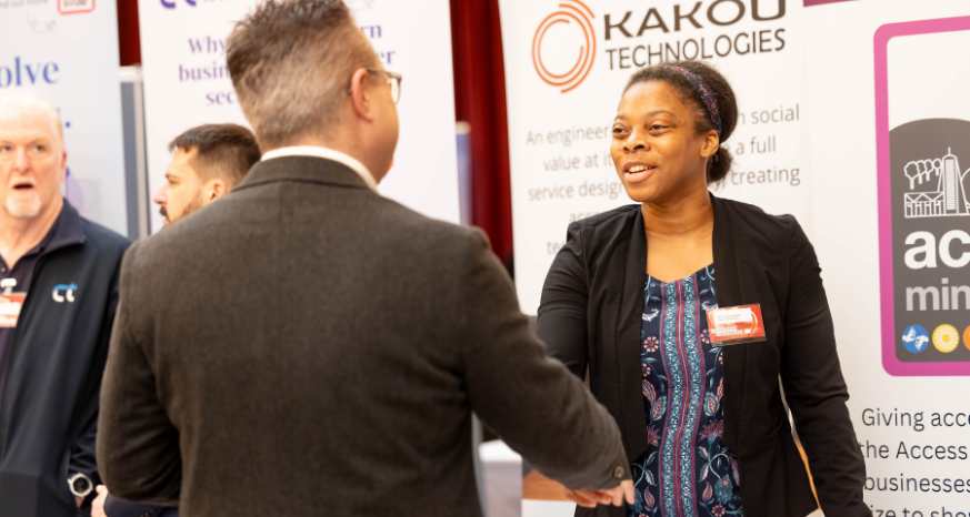 Female shaking hands with male at the Celebrate Chesterfield Business Expo