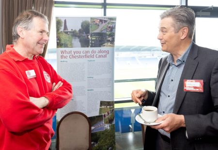 2 males chatting at a Chesterfield Champions event