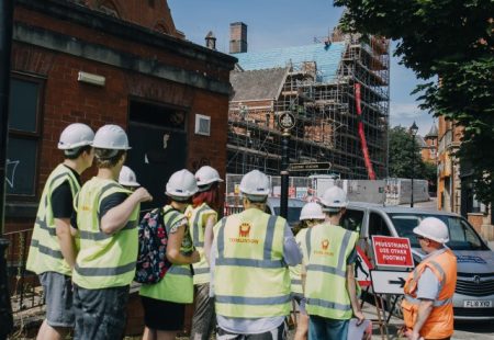 Students wearing high viz jackets outside Stephenson memorial hall