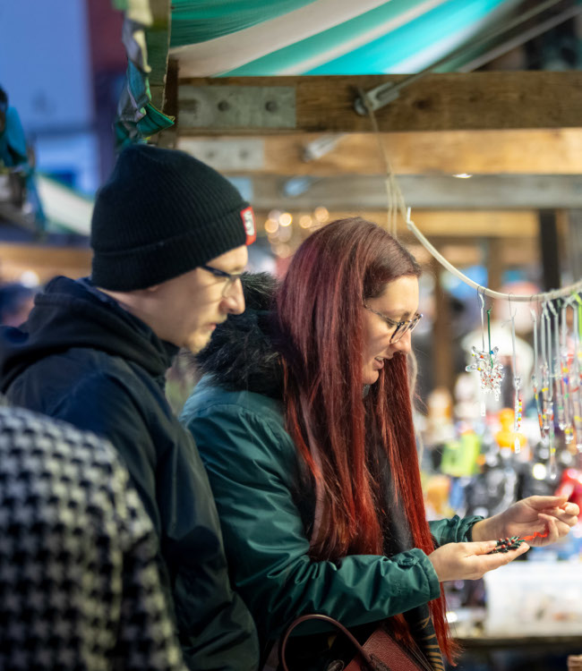 Man and woman looking at items at items at Chesterfield Market