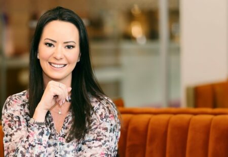 Female with dark hair smiles for camera