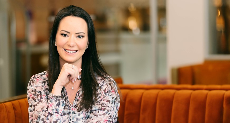 Female with dark hair smiles for camera