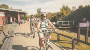 Woman cycling down Chesterfield Canal