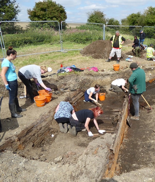 Team of volunteers digging in the mud at Chesterfield Canal