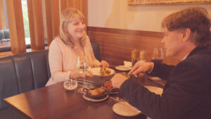 Couple enjoying food at Cocina Restaurant at Casa