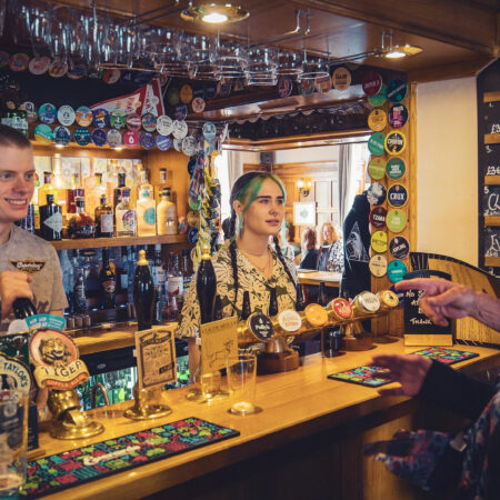 Staff serving beer at Chesterfield Arms