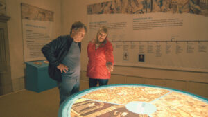 Couple looking at exhibition at Hardwick Hall