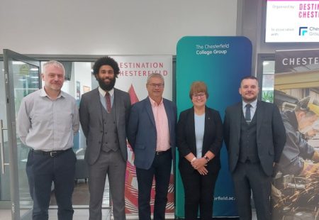 Business Leaders launching campaign at Chesterfield College wearing formal attire and smiling for the camera