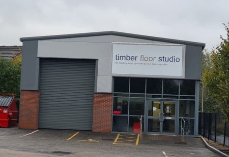 Front of new trade counter industrial building with Timber Floor Studio signage outside