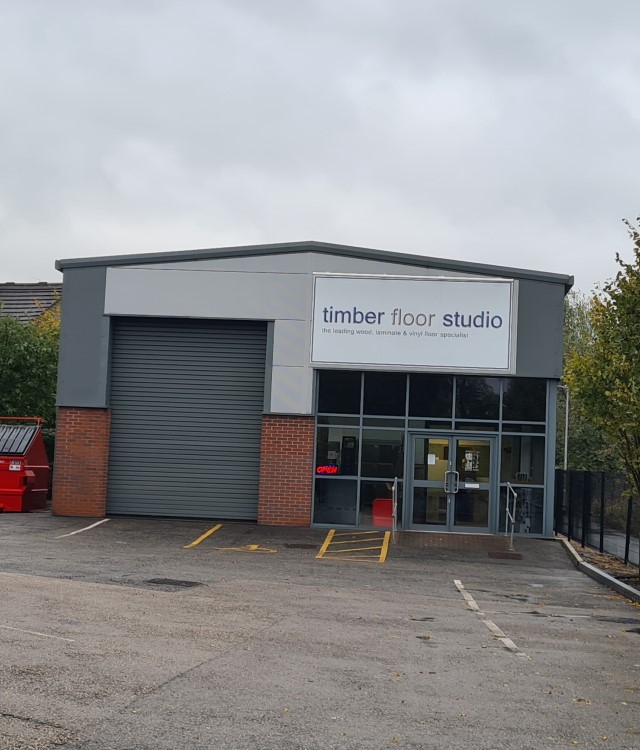 Front of new trade counter industrial building with Timber Floor Studio signage outside