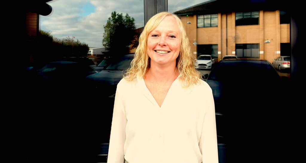 Carrie Booth stood in front of office entrance