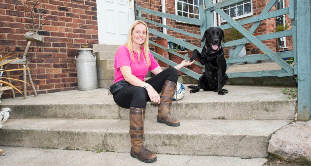 Doggy Daycare owner with black labrador 